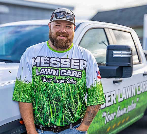 Messer Lawn Care Landscape employee smiling at camera